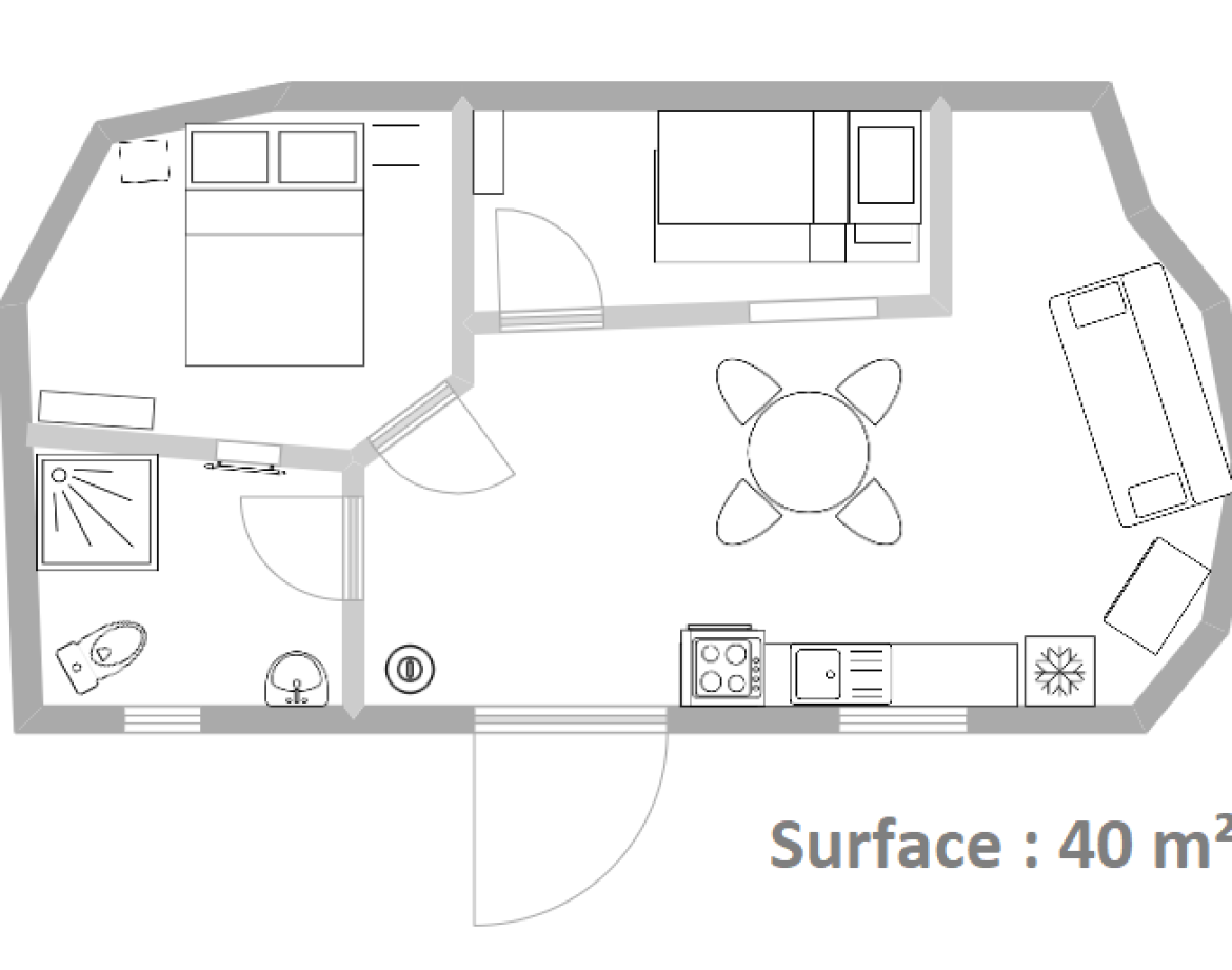 Hébergement insolite en Auvergne : un espace de 40 m² avec coin cuisine et salon.